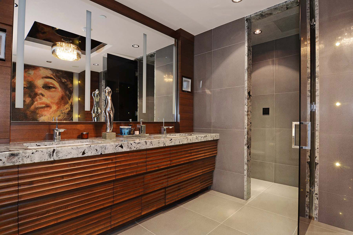 Marble sinks large mirror bathroom apartment in vancouver