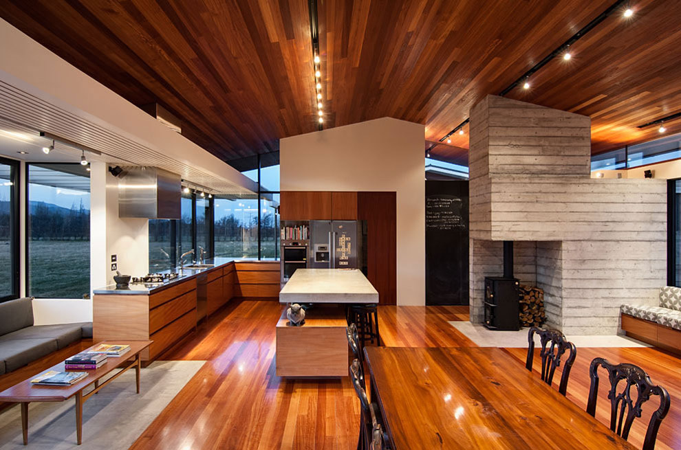 Kitchen, Dining Space, Fireplace, Wairau Valley House in Rapaura, New Zealand by Parsonson Architects