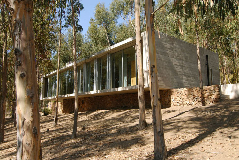 Large Windows, Stone Wall, Omnibus House in Cachagua, Chile by Gubbins Arquitectos
