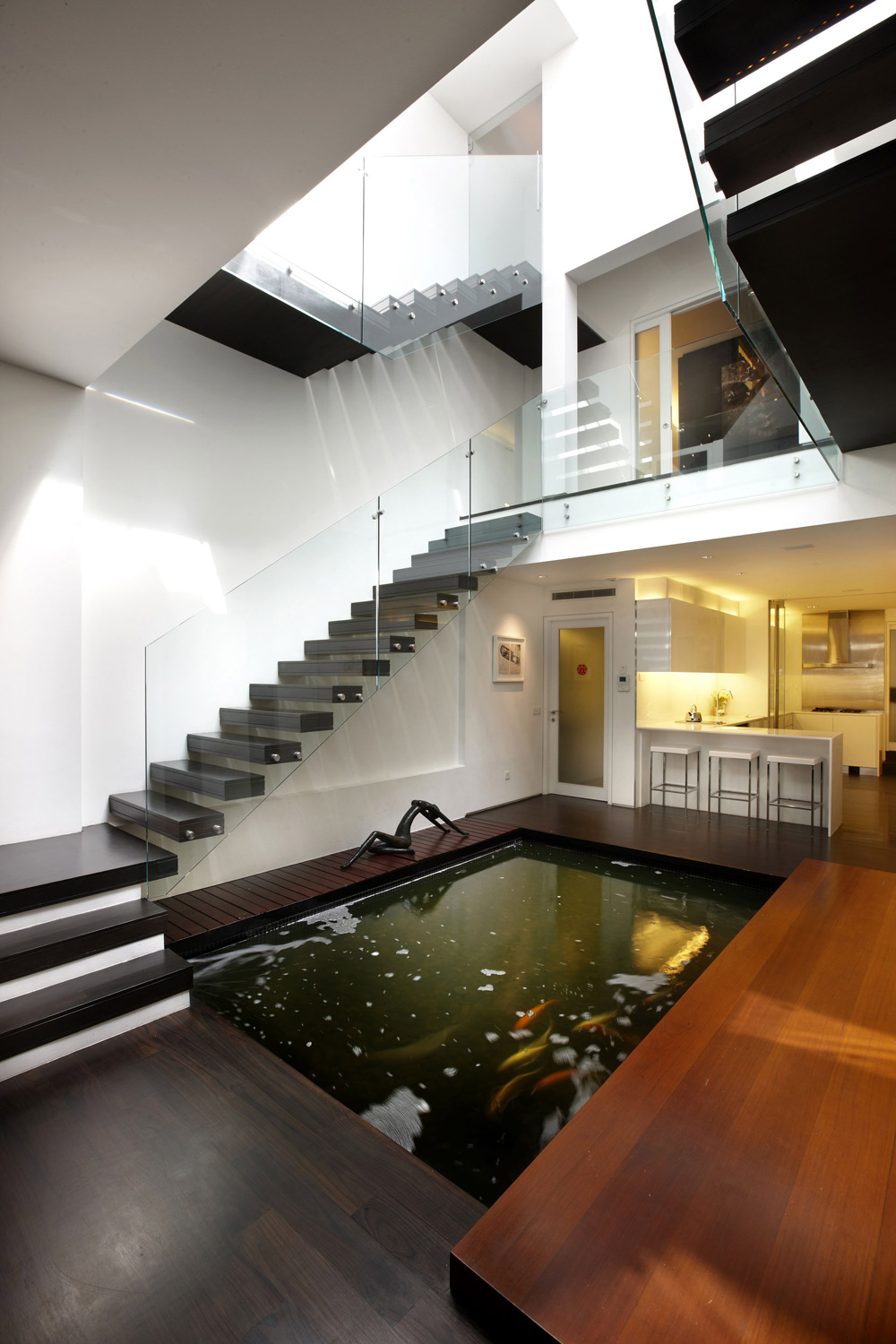 Indoor Koi Pond, Glass & Wood Stairs, Shop House Renovation in Singapore 