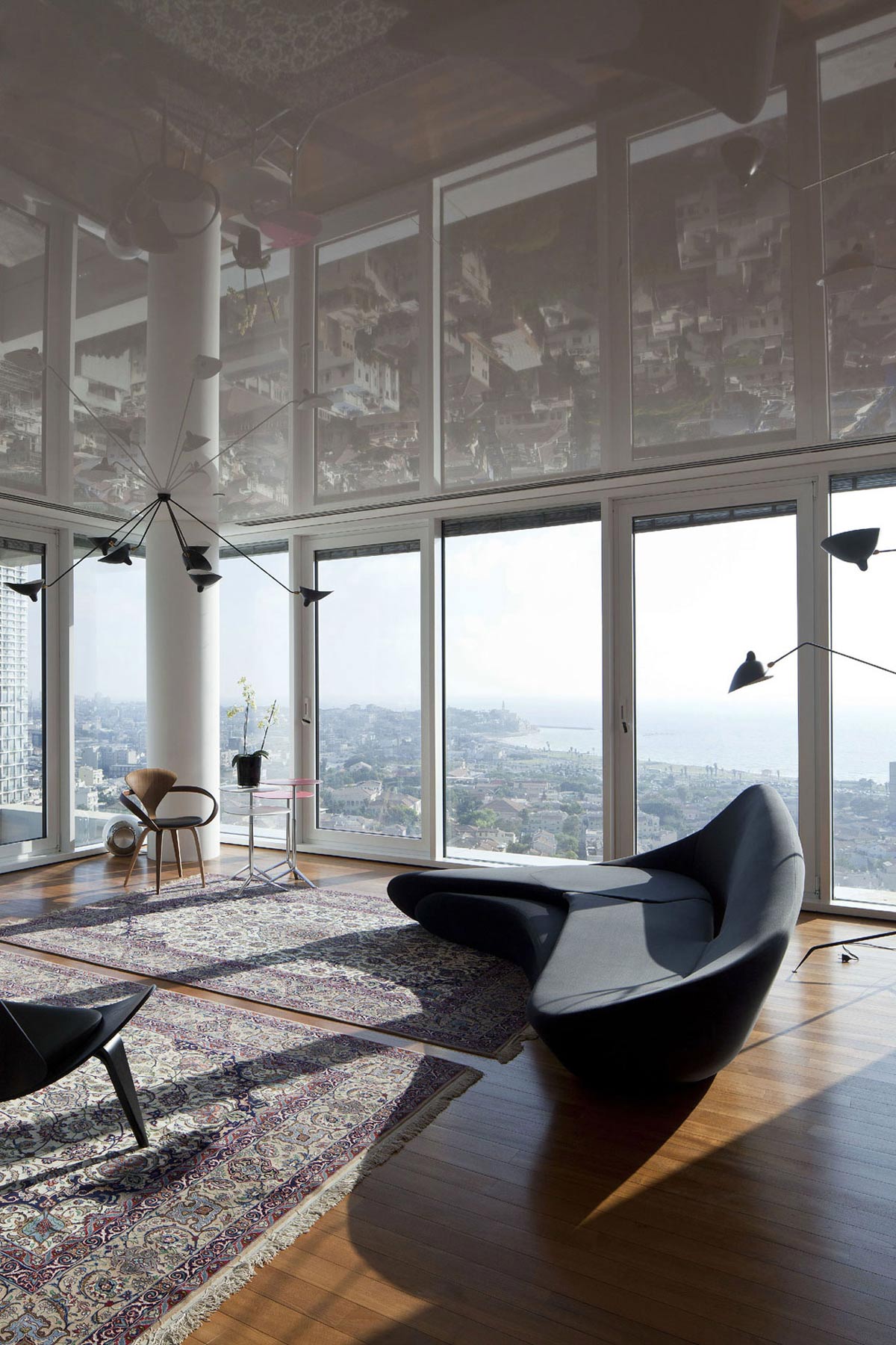 Modern Sofa, Rugs, Elegant Apartment with Reflective Ceiling in Tel Aviv, Israel